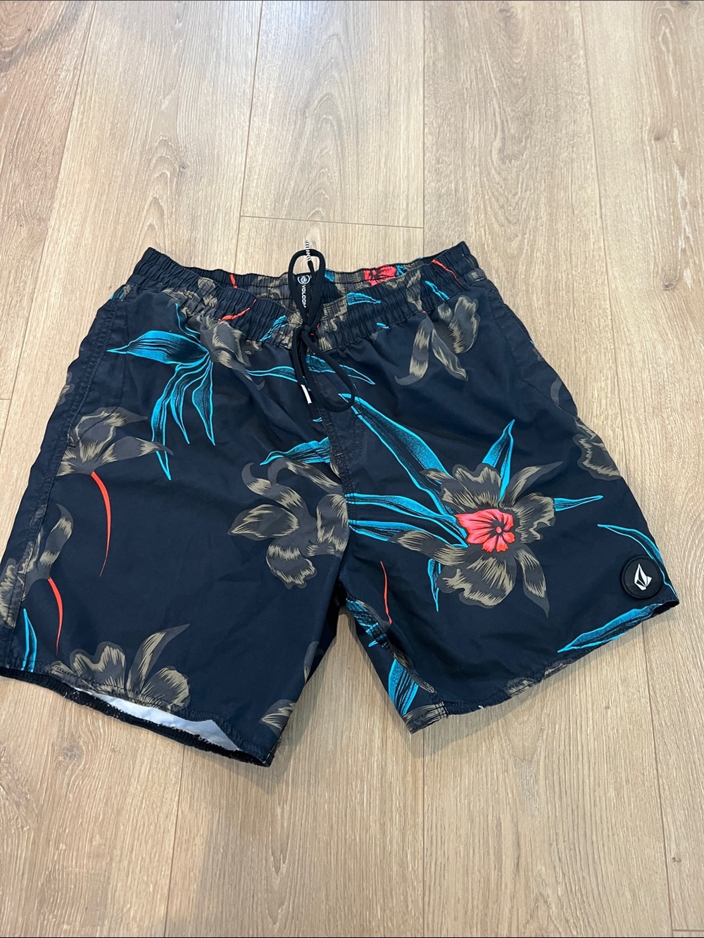 Volcom Black Floral Board Shorts with Teal and Red Accents